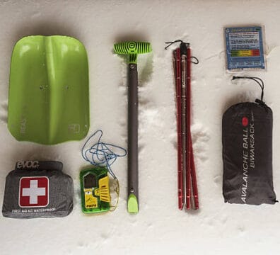 Image of winter kit, includes : First Aid Kit, a Shovel and a Battery