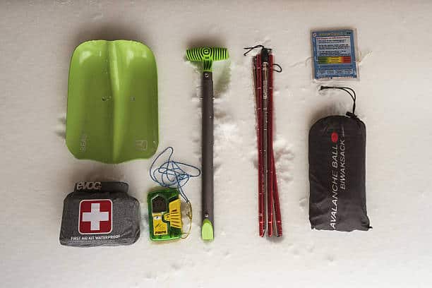 Image of winter kit, includes : First Aid Kit, a Shovel and a Battery