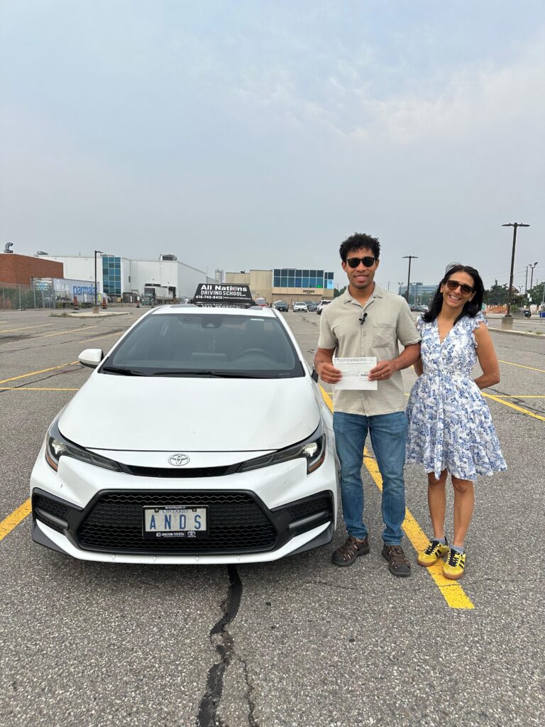 Professional driving instructor helping new driver